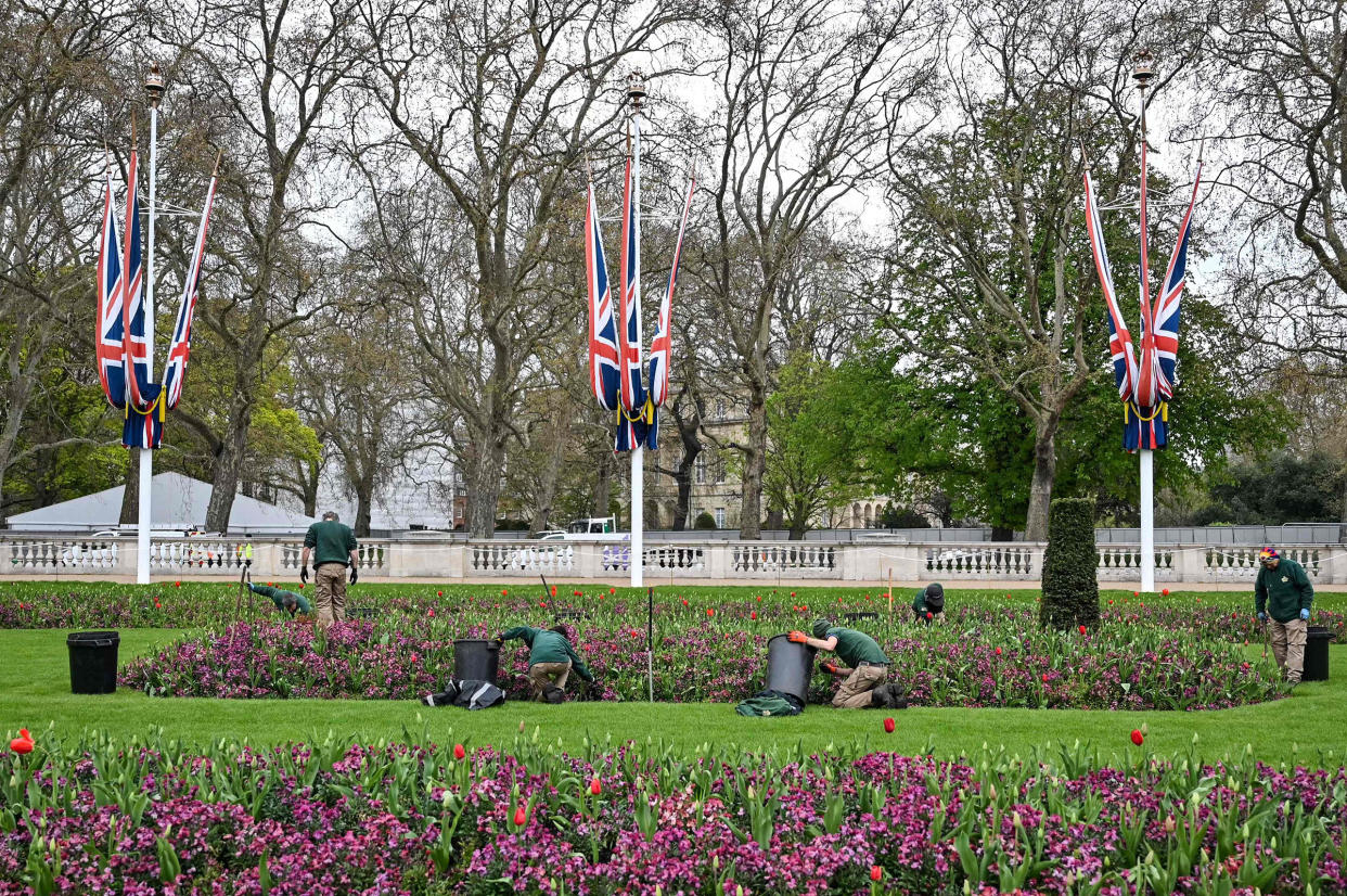 Workers prepare the Memorial gardens, in central London, on April 18, 2023.