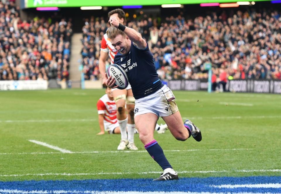 Scotland’s Stuart Hogg celebrates before scoring his record-breaking try (Malcolm Mackenzie/PA) (PA Wire)