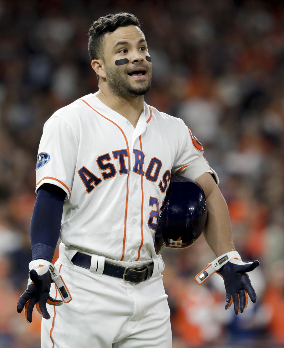 Houston Astros' Jose Altuve after flying out due to fan interference during the first inning in Game 4 of a baseball American League Championship Series against the Boston Red Sox on Wednesday, Oct. 17, 2018, in Houston. (AP Photo/David J. Phillip)