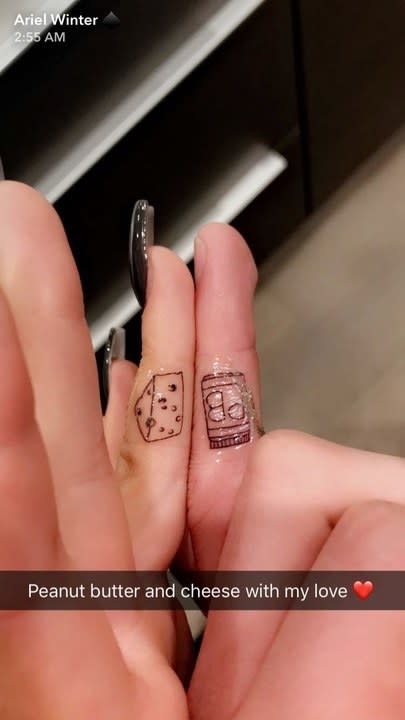 Peanut butter and cheese finger tattoos on Ariel's snapchat