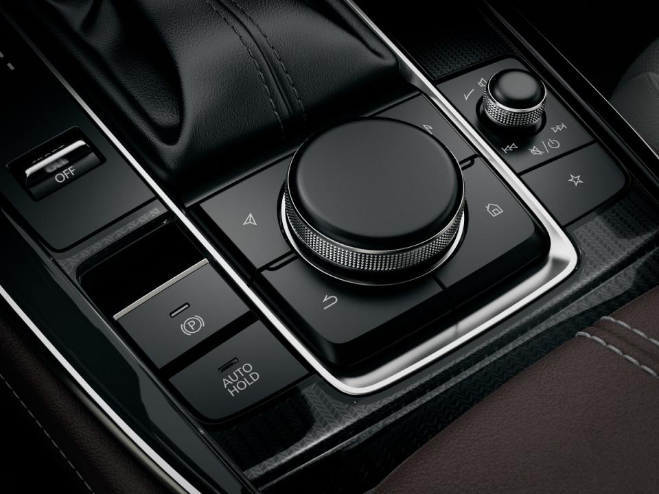 The Mazda Sport Mode button is located next to the gear stick for a sporty driving experience. — Picture courtesy of Bermaz Motor