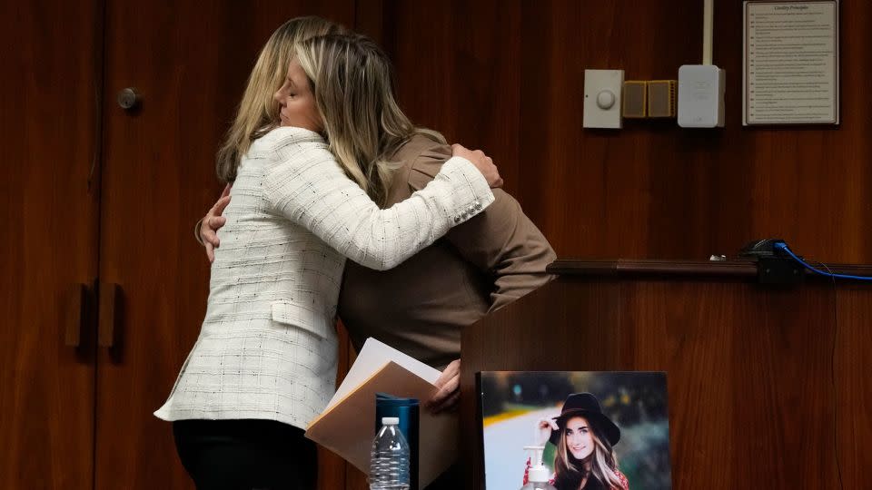 Oakland County prosecutor Karen McDonald hugs Nicole Beausoleil, mother of Madisyn Baldwin, during Ethan Crumbley's sentencing hearing. - Carlos Osorio/AP