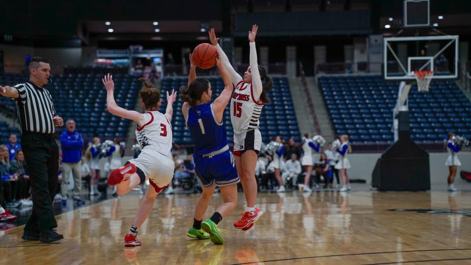 Holy Cross guards Alyssa Arlinghaus (3) and Aniyah Carter (15) double-team Nicholas County's Sydney Carpenter (1) during a game between the Indians and Lady Jackets at the All 'A' state tournament on Jan. 27 at Corbin Arena in Corbin, Ky.