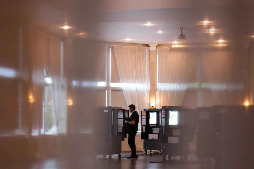 A person votes in the Georgia's primary election on Tuesday, May 24, 2022, in Atlanta. (AP Photo/Brynn Anderson)