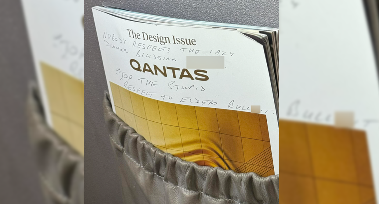 Qantas in-flight magazine tucked inside pouch in front of seat shows the handwritten message scribbled in pen. 
