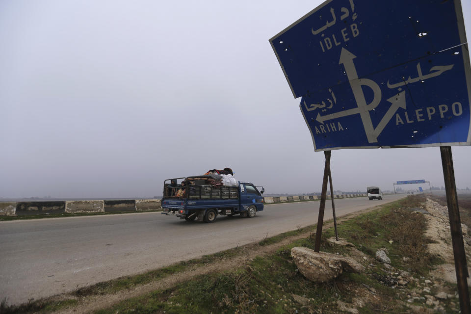 Civilians ride in a truck as they flee Maaret al-Numan, Syria, ahead of a government offensive, Monday, Dec. 23, 2019. (AP Photo/Ghaith al-Sayed)