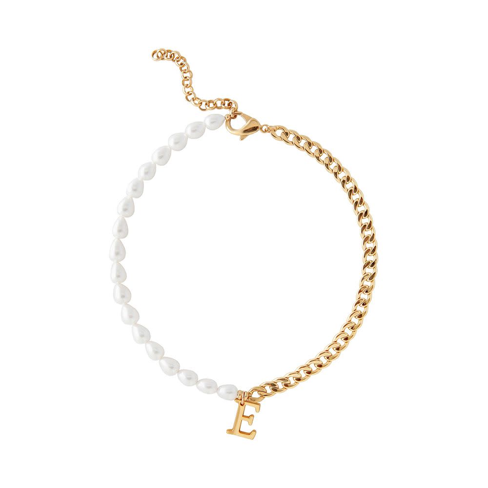 <p><a href="https://marthacalvo.com/products/pearl-and-chain-initial-necklace?variant=33837153190026" rel="nofollow noopener" target="_blank" data-ylk="slk:Shop Now;elm:context_link;itc:0;sec:content-canvas" class="link rapid-noclick-resp">Shop Now</a></p><p>Pearl and Chain Initial Necklace</p><p>marthacalvo.com</p><p>$240.00</p>