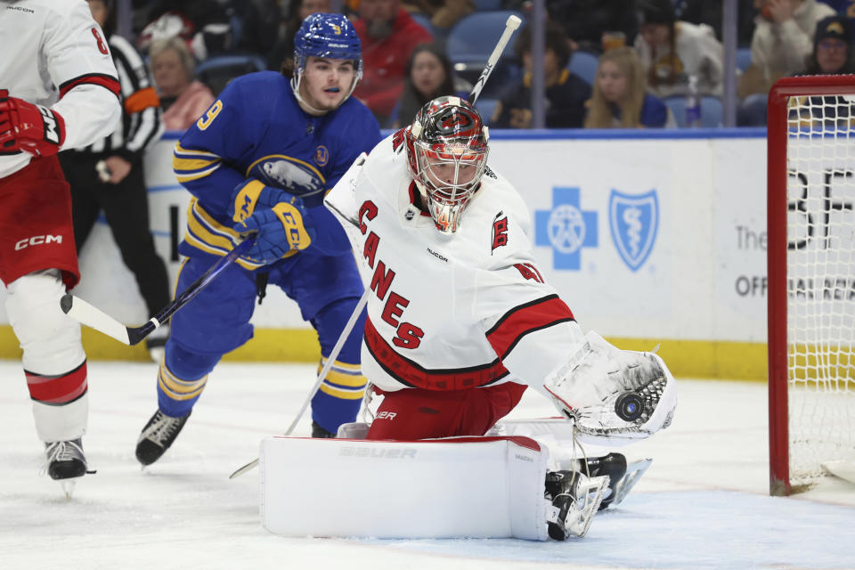 Carolina Hurricanes goaltender Spencer Martin (41) reaches for the puck during the first period of an NHL hockey game against the Buffalo Sabres, Sunday, Feb. 25, 2024, in Buffalo, N.Y. (AP Photo/Jeffrey T. Barnes)