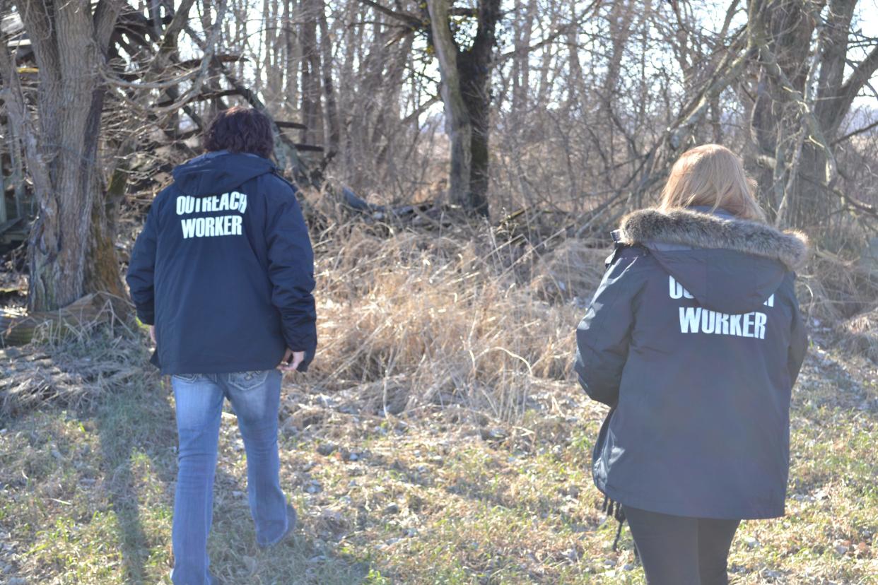 Laura McCoy, outreach coordinator for Wellspring, and Courtney Mathis, an outreach worker, look for unsheltered residents in Martinsville as part of the organization's Point-in-Time (PIT) count, Wednesday, Jan. 26, 2021.