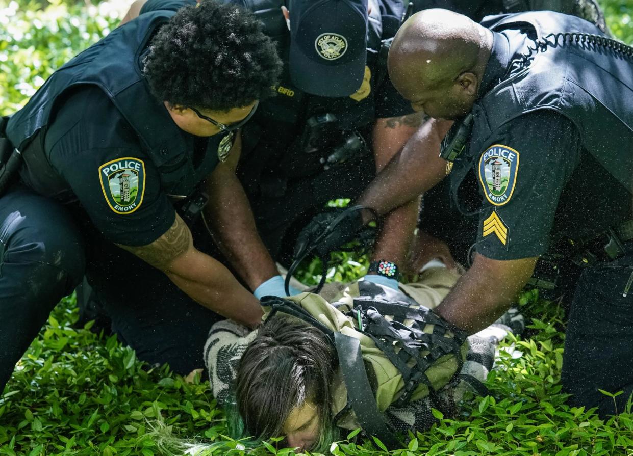 <span>Police detain a demonstrator during a protest against the war in Gaza at Emory University in Georgia on Thursday.</span><span>Photograph: Elijah Nouvelage/AFP/Getty Images</span>