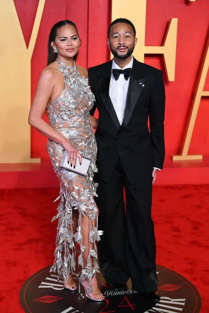 BEVERLY HILLS, CALIFORNIA - MARCH 10: Chrissy Teigen and John Legend attend the 2024 Vanity Fair Oscar Party hosted by Radhika Jones at the Wallis Annenberg Center for the Performing Arts on March 10, 2024 in Beverly Hills, California. (Photo by Karwai Tang/WireImage)