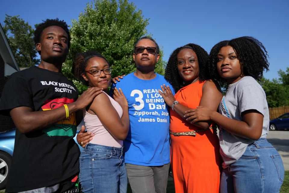 A portrait of James Melton, 53, center, with his wife and children on Tuesday, June 14, at their home in Indianapolis. James and his family took in his three nephews last year when they're mother died after a heart attack.