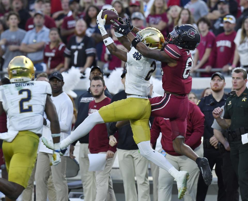 Notre Dame Fighting Irish cornerback Benjamin Morrison (20) intercepts a late second quarter pass intended for South Carolina Gamecocks wide receiver O'Mega Blake (89). The University of Notre Dame Fighting Irish took on the University of South Carolina Gamecocks in the TaxSlayer Gator Bowl game in Jacksonville, Florida's TIAA Bank Field Friday, December 30, 2022. The first half ended with South Carolina holding a 24 to 17 lead. [Bob Self/Florida Times-Union]

Jki 123022 Bs Gatorbowl 03

Syndication Florida Times Union

Syndication Notre Dame Insider