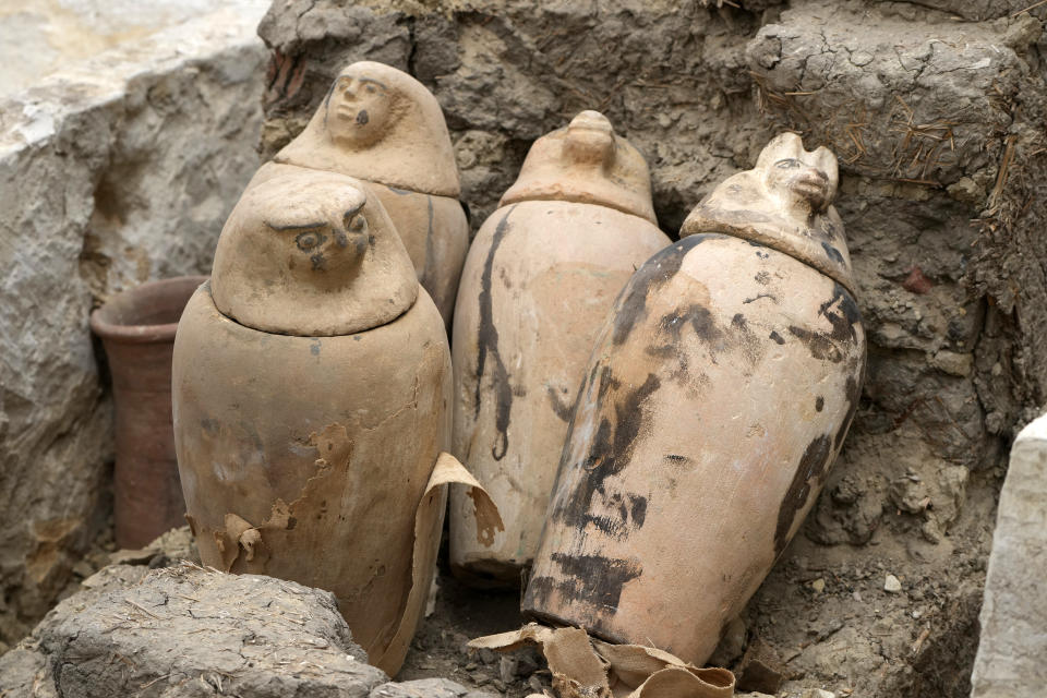 Canopic jars, which were made to contain organs that were removed from the body in the process of mummification, are seen at the site of the Step Pyramid of Djoser in Saqqara, 24 kilometers (15 miles) southwest of Cairo, Egypt, Saturday, May 27, 2023. Saqqara is a part of Egypt's ancient capital of Memphis, a UNESCO World Heritage site. (AP Photo/Amr Nabil)