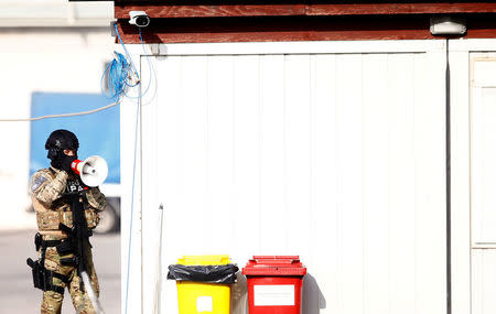 Participants of the European Union Force (EUFOR), Armed Forces, Border Police and State Investigation and Protection Agency (SIPA) of Bosnia and Herzegovina practice an anti-terrorism situation during an exercise at the Sarajevo International Airport, Bosnia and Herzegovina October 13, 2017. REUTERS/Dado Ruvic