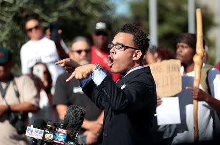 Rev. Shane Harris speaks to protesters gathered at the El Cajon Police Department headquarters to protest fatal shooting of an unarmed black man Tuesday by officers in El Cajon, California, U.S. September 28, 2016. REUTERS/Earnie Grafton