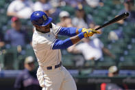 Seattle Mariners' Kyle Lewis singles against the Cleveland Indians in the third inning of a baseball game Sunday, May 16, 2021, in Seattle. (AP Photo/Elaine Thompson)