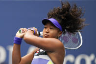 FILE - In this Sept. 12, 2020, file photo, Naomi Osaka, of Japan, returns a shot to Victoria Azarenka, of Belarus, during the women's singles final of the US Open tennis championships, in New York. U.S. Open champion Osaka has pulled out of the French Open because of an injured hamstring. Osaka joins No. 1-ranked Ash Barty in skipping the French Open, which opens on Monday, Sept. 21. (AP Photo/Seth Wenig, File)