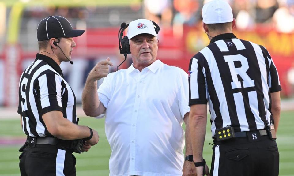 Fresno State football coach Jeff Tedford talks with the officials during a timeout of their game against Eastern Washington at Valley Children’s Stadium on Saturday, Sept. 9, 2023.