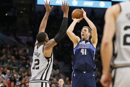 Nov 27, 2017; San Antonio, TX, USA; Dallas Mavericks power forward Dirk Nowitzki (41) shoots the ball over San Antonio Spurs power forward LaMarcus Aldridge (12) during the second half at AT&T Center. Mandatory Credit: Soobum Im-USA TODAY Sports