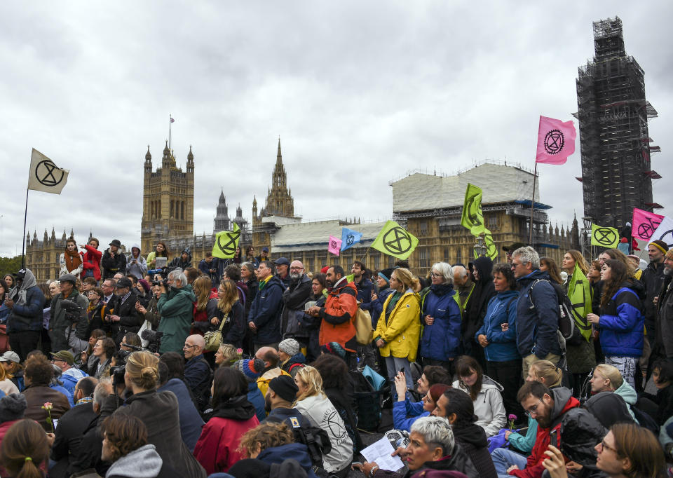 Climate activist gather on Westminster Bridge, during an Extinction Rebellion protest in London, Monday, Oct. 7, 2019. London Police say some 135 climate activists have been arrested as the Extinction Rebellion group attempts to draw attention to global warming. Demonstrators playing steel drums marched through central London on Monday as they kicked off two weeks of activities designed to disrupt the city. (AP Photo/Alberto Pezzali)