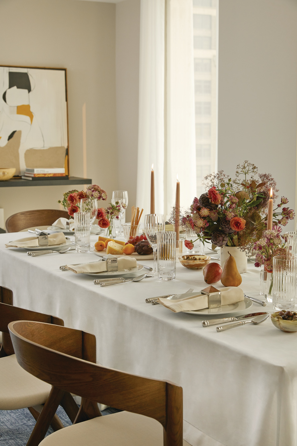 A Christmas tablescape with candles and table napkins