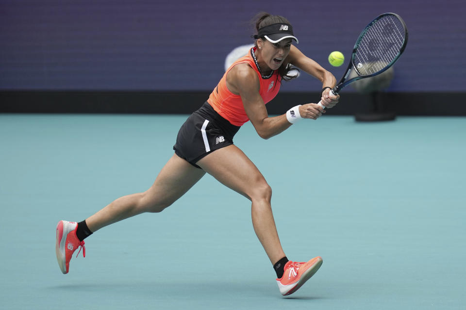Sorana Cirstea, of Romania, returns a volley against Petra Kvitova, of the Czech Republic, in the first set of a match at the Miami Open tennis tournament, Friday, March 31, 2023, in Miami Gardens, Fla. (AP Photo/Jim Rassol)