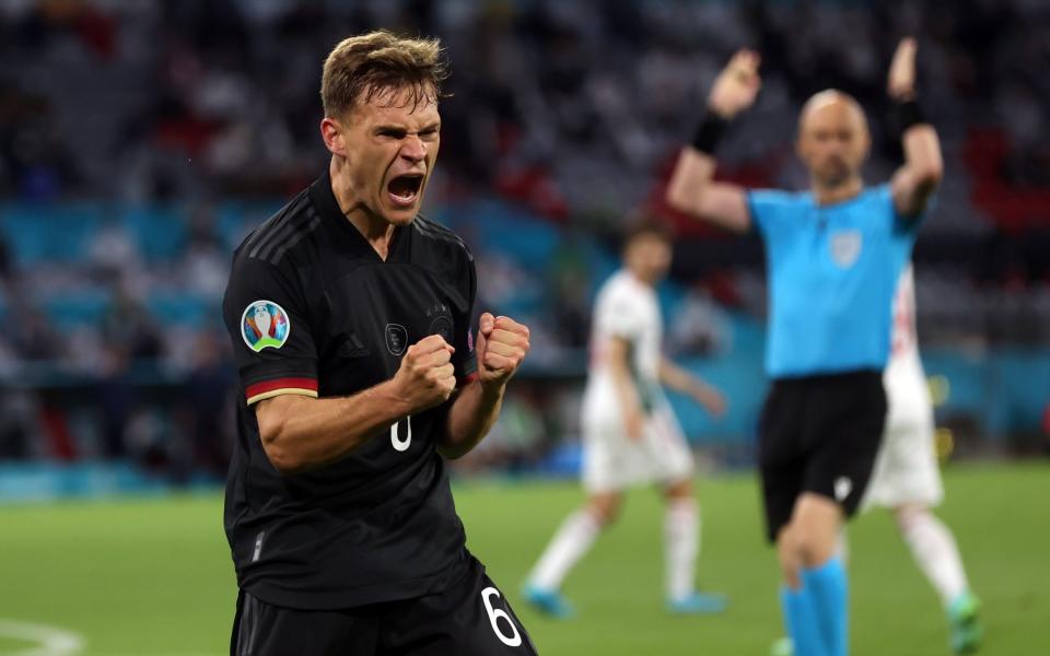 Joshua Kimmich celebrates Germany's late goal against Hungary at Euro 2020