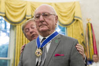 President Donald Trump presents the Presidential Medal of Freedom to former NBA basketball player and coach Bob Cousy, of the Boston Celtics, during a ceremony in the Oval Office of the White House, Thursday, Aug. 22, 2019, in Washington. (AP Photo/Alex Brandon)