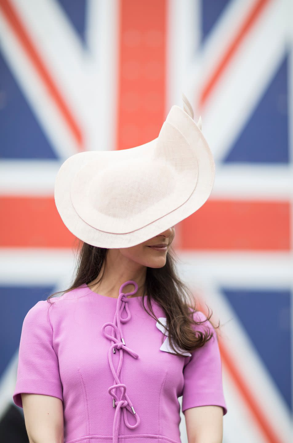 Ariana Rockefeller wears a Philip Treacy blush hat on Day 1.