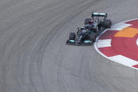 Mercedes driver Lewis Hamilton, of Britain, moves into a turn during a practice session for the F1 US Grand Prix auto race at Circuit of the Americas, Friday, Oct. 22, 2021, in Austin, Texas. (AP Photo/Nick Didlick)