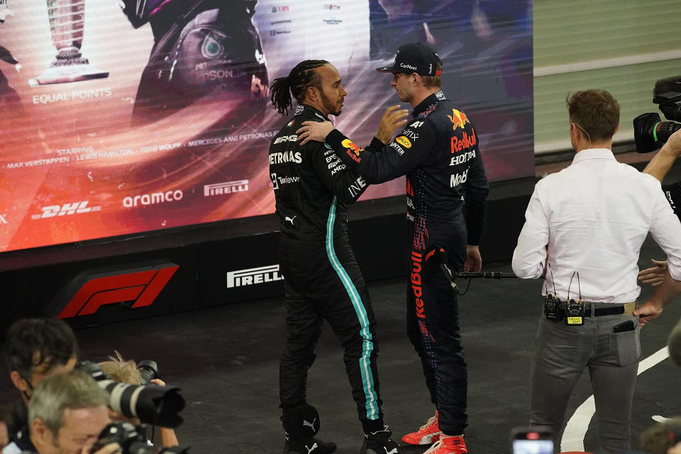 Lewis Hamilton (pictured left) congratulates Max Verstappen (pictured right) after the F1 Grand Prix of Abu Dhabi at Yas Marina Circuit on December 12, 2021 in Abu Dhabi, United Arab Emirates.