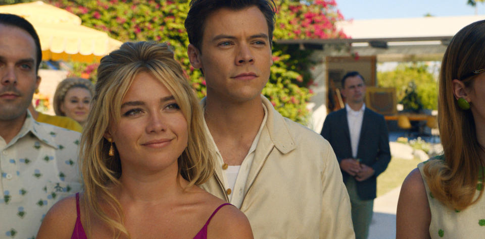 This image released by Warner Bros. Entertainment shows Florence Pugh, left, and Harry Styles in a scene from "Don't Worry Darling." (Warner Bros. Entertainment via AP)
