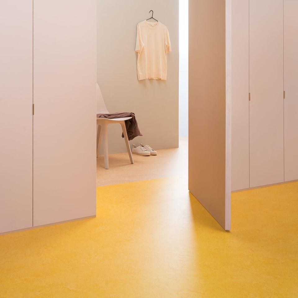 This color-blocked dressing room floor is Marmoleum Real (a type of linoleum) from Forbo.