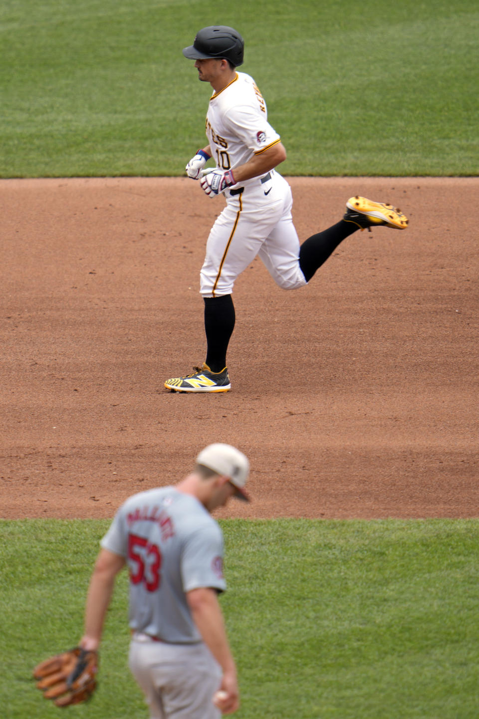 Pittsburgh Pirates' Bryan Reynolds (10) rounds the bases after hitting a solo home run off St. Louis Cardinals pitcher Andre Pallante (53) during the fourth inning of a baseball game in Pittsburgh, Thursday, July 4, 2024. (AP Photo/Gene J. Puskar)