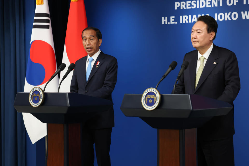 Indonesian President Joko Widodo, left, speaks as South Korean President Yoon Suk Yeol listens during their joint news conference at the presidential office in Seoul, South Korea, Thursday, July 28, 2022. (Suh Myung-gon/Yonhap via AP)