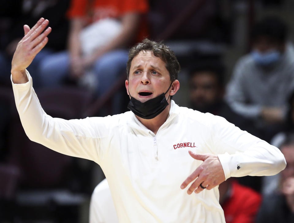 Cornell coach Brian Earl gestures during the first half of the team's NCAA college basketball game against Virginia Tech on Wednesday, Dec. 8 2021, in Blacksburg, Va. (Matt Gentry/The Roanoke Times via AP)