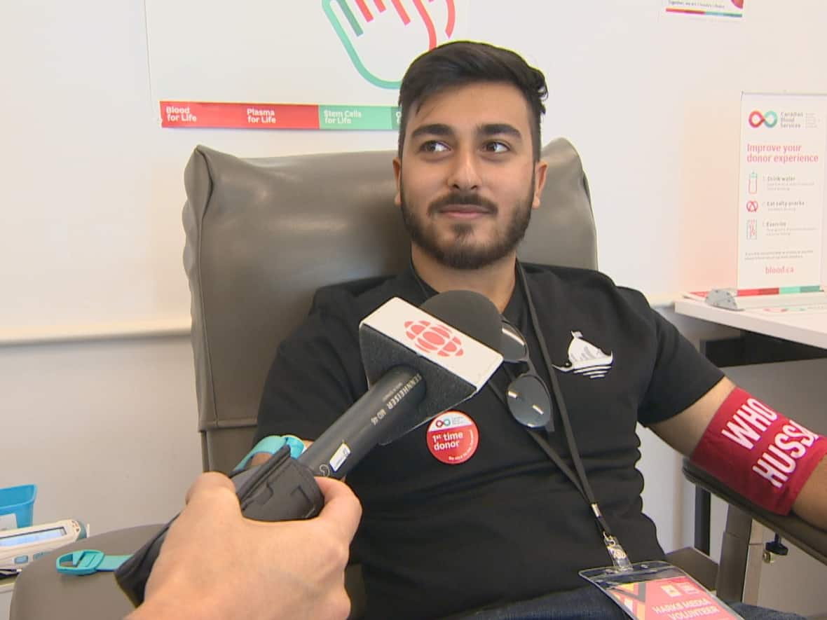 Ali Ridah Fazal, a volunteer, donated blood in Richmond Hill, Ont. on Saturday as part of effort by Who is Hussain, a U.K.-based Muslim charity, to break the world record of the most amount of blood donated in one day. (CBC - image credit)