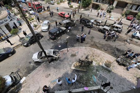 A view shows burnt cars at the site of a car bomb attacked the convoy of Egyptian public prosecutor Hisham Barakat near his house at Heliopolis district in Cairo, Egypt, June 29, 2015. REUTERS/Mohamed Abd El Ghany