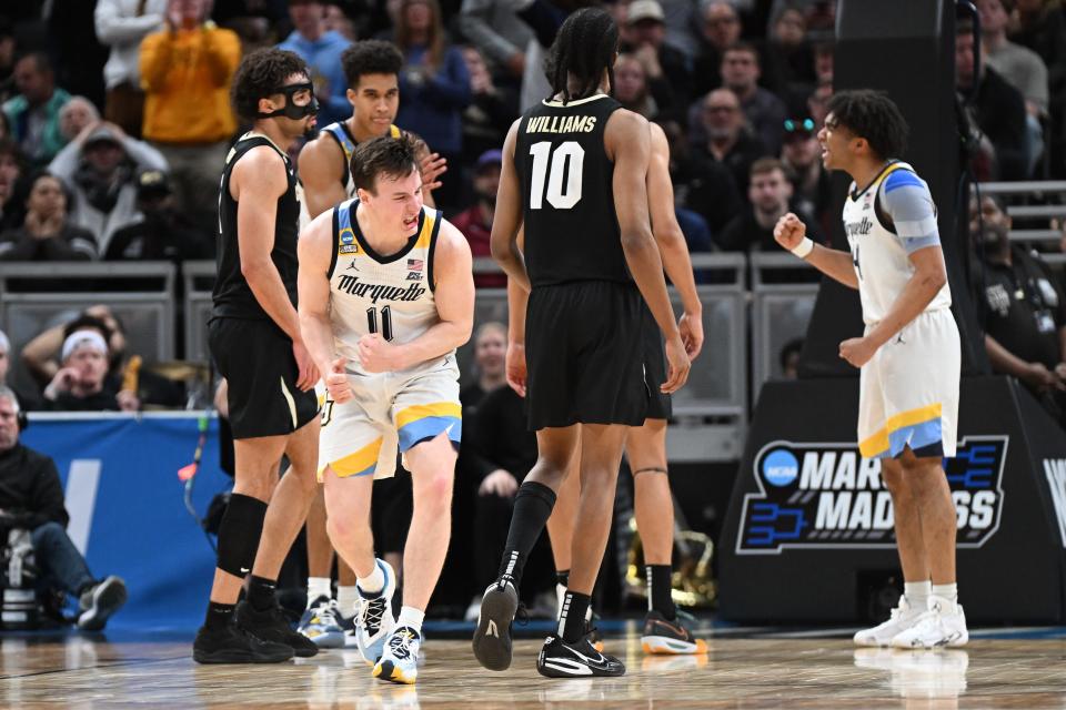 Marquette Golden Eagles guard Tyler Kolek (11) reacts during the second half against the Colorado Buffaloes at Gainbridge FieldHouse.