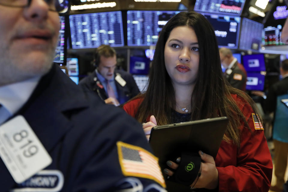 Trader Ashley Lara works on the floor of the New York Stock Exchange, Monday, Jan. 27, 2020. Stock tumbled at the open on Wall Street following a sell-off in markets in Europe and Japan as investors grow more concerned about the potential economic impact of an outbreak of a deadly coronavirus. (AP Photo/Richard Drew)