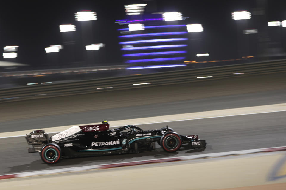 Mercedes driver Valtteri Bottas of Finland steers his car during the qualifying session for Sunday's Bahrain Formula One Grand Prix, at the Bahrain International Circuit in Sakhir, Bahrain, Saturday, March 27, 2021. The Bahrain Formula One Grand Prix will take place on Sunday. (AP Photo/Kamran Jebreili)