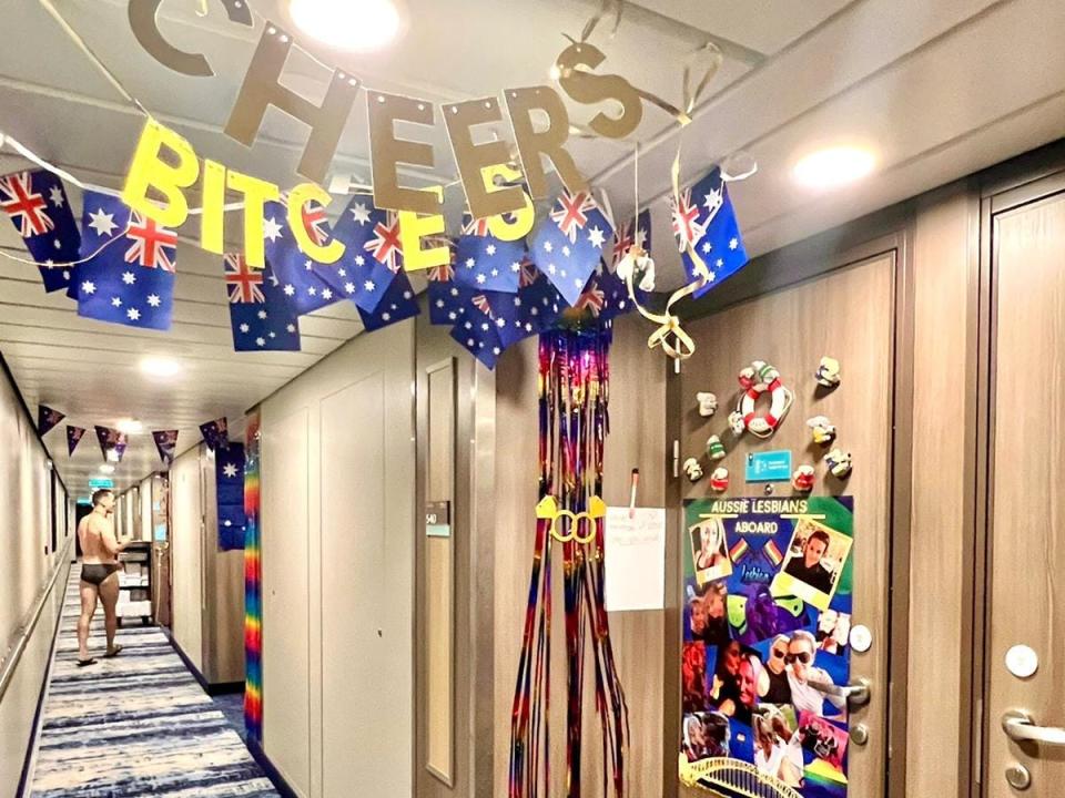 a decorated hallway on a cuirse with cheers signs and rainbows