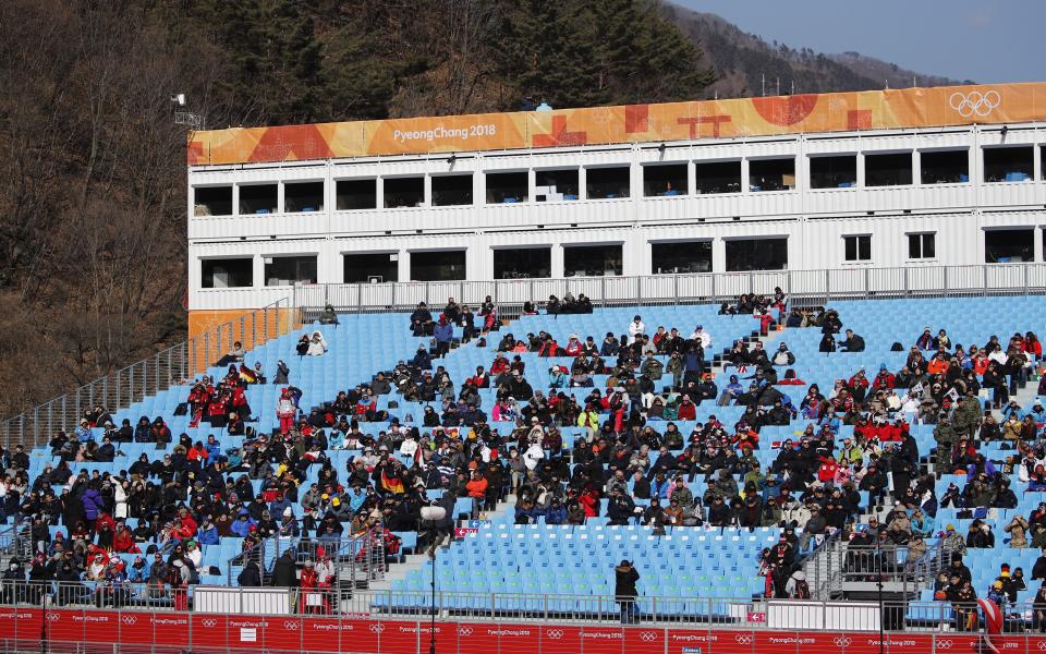 Spectators watch the downhill portion of the men’s combined at the 2018 Winter Olympics in Jeongseon, South Korea, Tuesday, Feb. 13, 2018. (The Canadian Press/AP Photo/Christophe Ena)