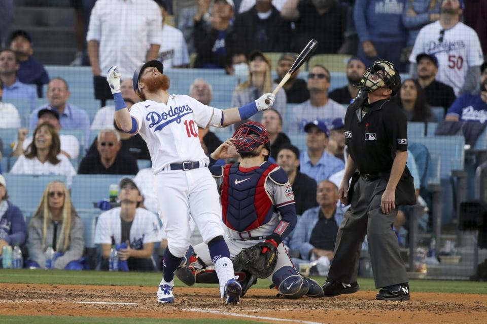 Dodgers third baseman Justin Turner leans back with his arms spread after popping out.