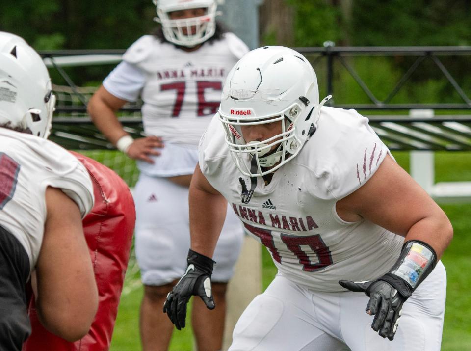 Anna Maria linebacker Ahmad Traoui runs drills with his team during a recent practice.