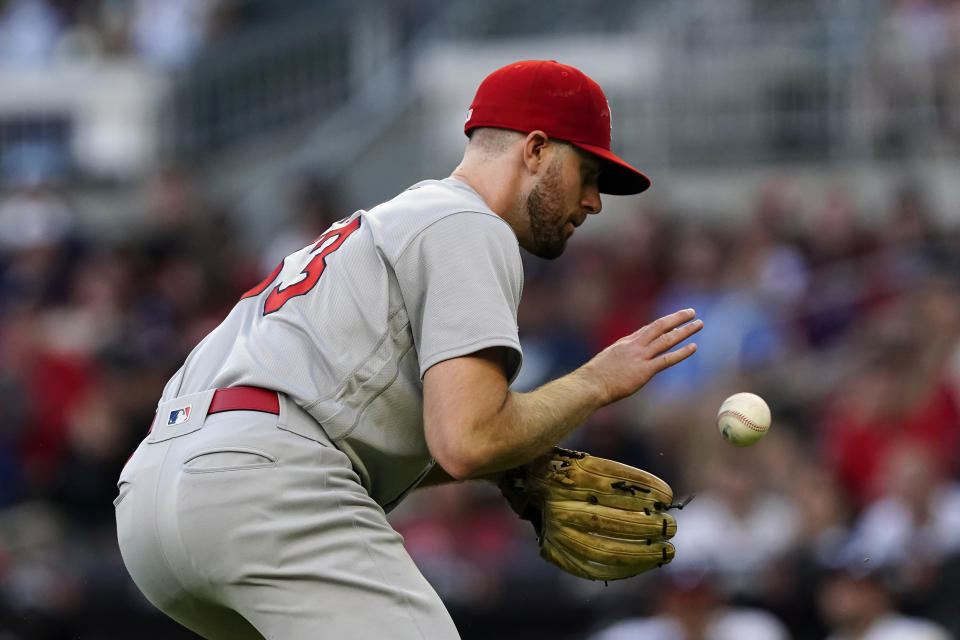 St. Louis Cardinals starting pitcher John Gant fields a ball hit to him by Atlanta Braves' Freddie Freeman in the third inning of a baseball game Thursday, June 17, 2021, in Atlanta. (AP Photo/John Bazemore)