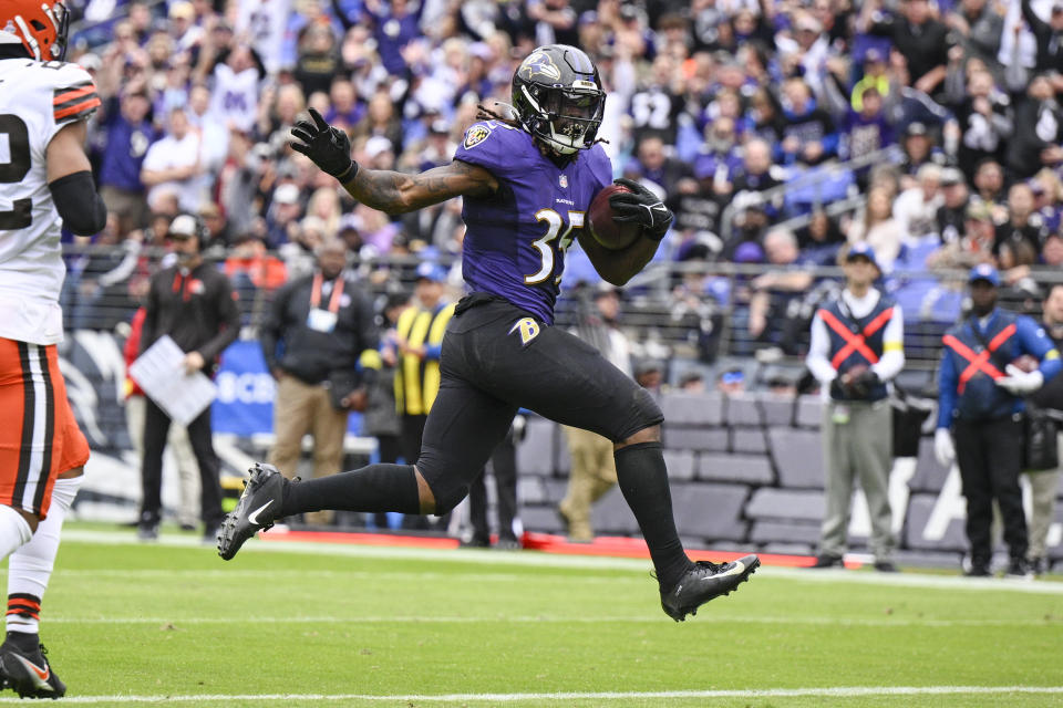 Baltimore Ravens running back Gus Edwards (35) runs for a touchdown against the Cleveland Browns in the first half of an NFL football game, Sunday, Oct. 23, 2022, in Baltimore. (AP Photo/Nick Wass)