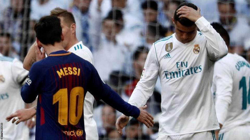 Lionel Messi and Cristiano Ronaldo shake hands after an El Clasico meeting between Barcelona and Real Madrid