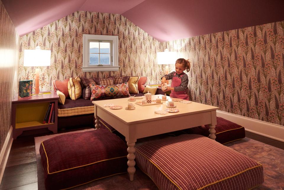 The attic room’s colors, purple and gold, are taken from Louisiana State University, alma mater to Janice and Lee. Lippmann found the wallpaper through U.K. manufacturer Abigail Borg. The tea table is from English Farmhouse and the table lamps are by Stray Dog Designs. The tea set belongs to Janice and Lee’s granddaughter, but in this photo, Lippmann’s daughter Sawyer takes them out for a spin.